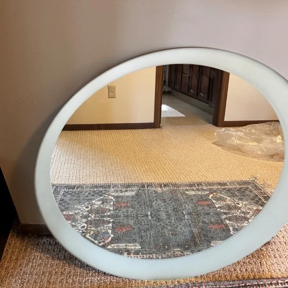 Round modern mirror with glazed edge